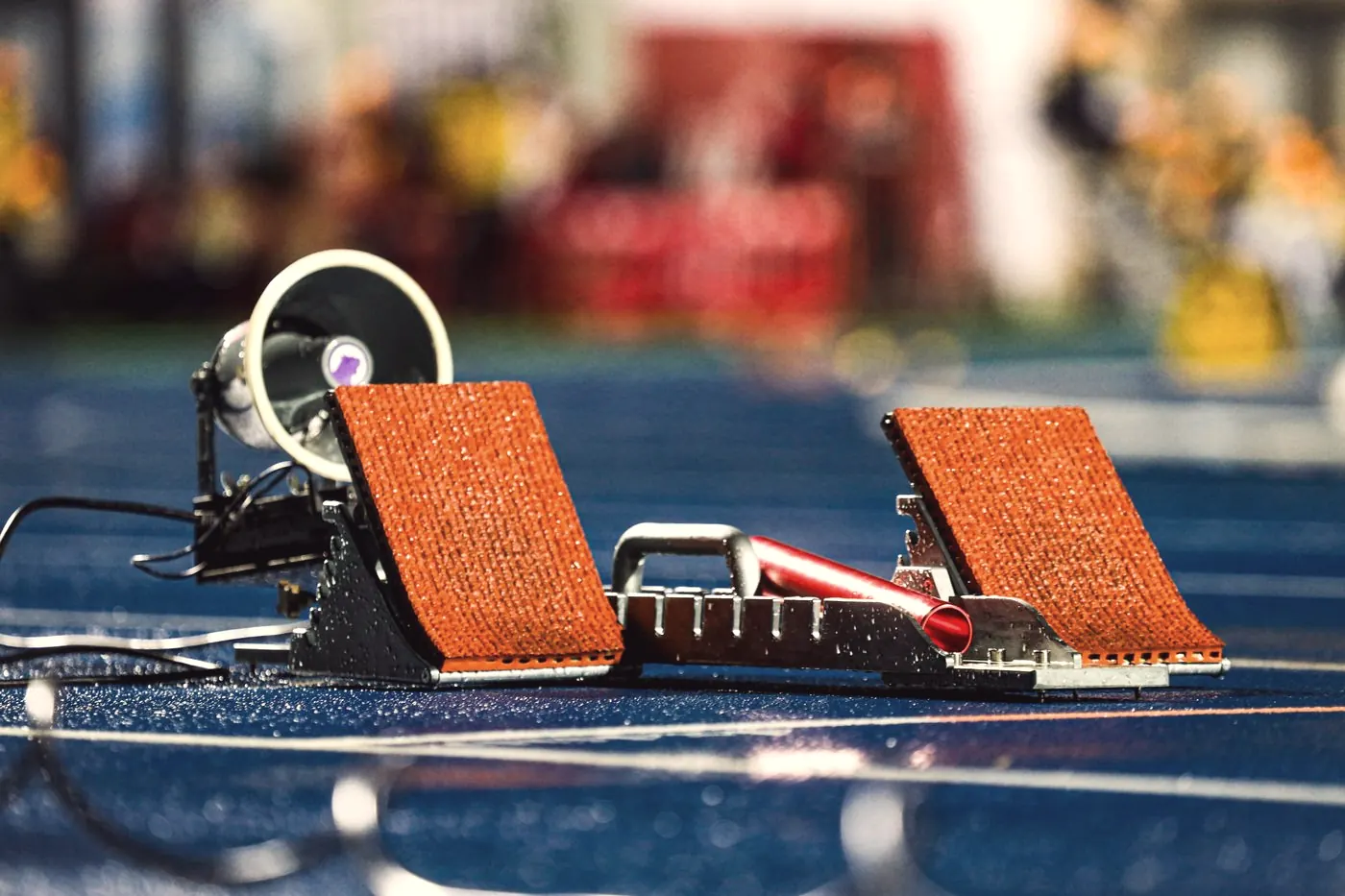 Starting blocks on a blue athletics track, the starting point that a baseline HIV test sets