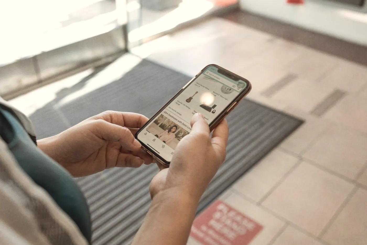 Hands holding a smartphone while looking at medicine online