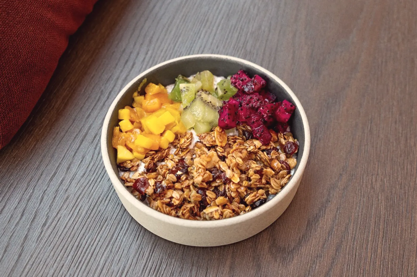 A breakfast bowl of fruit and granola, a gentle way to take PrEP with food