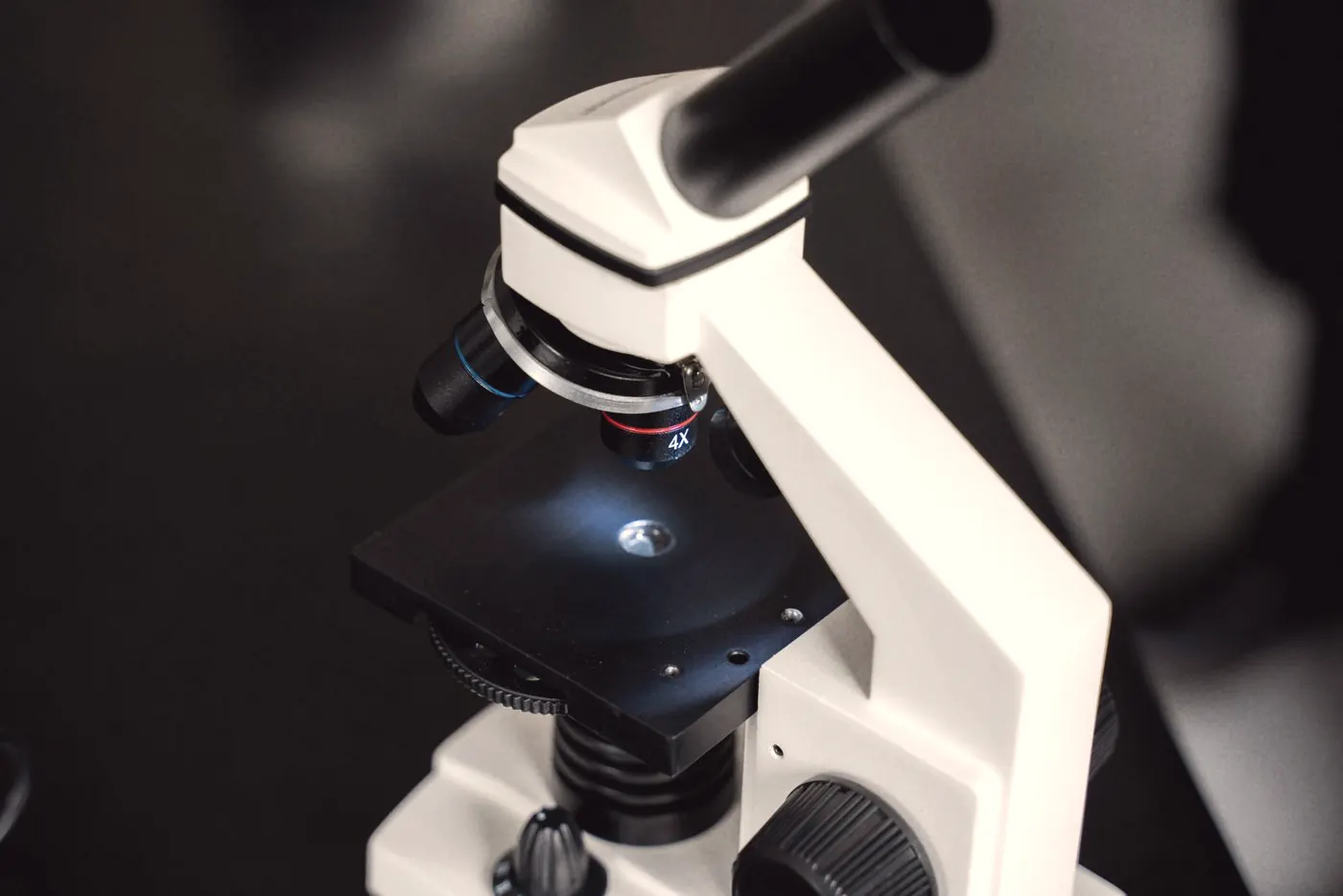 Close-up of a laboratory microscope used to examine samples during STI screening